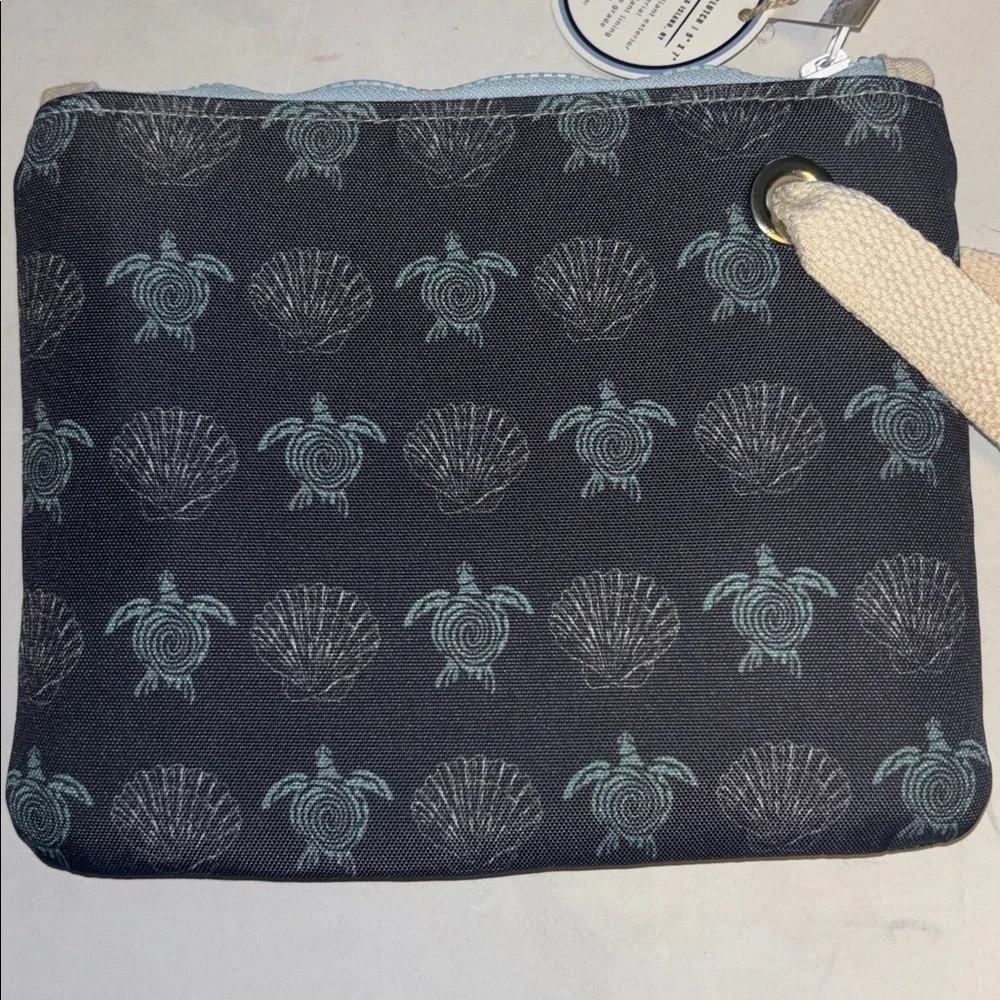 WAKES & WAVES BLUE WRISTLET WITH TURTLE DESIGN WATERPROOF CANVAS LIKE MATERIAL